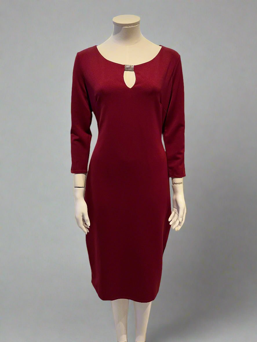 Mannequin wearing a burgundy dress with a white background